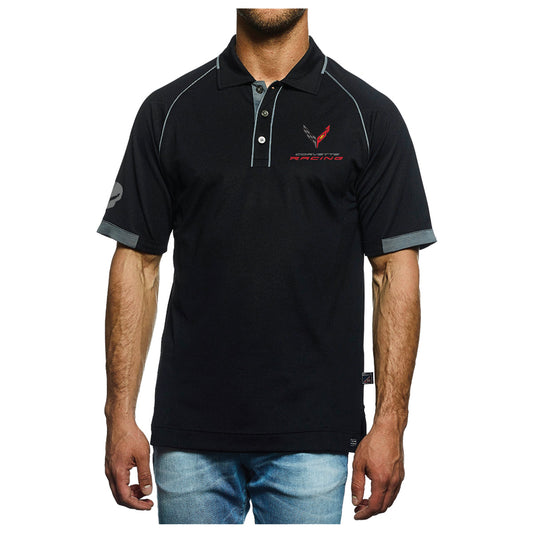 A man wearing a black short-sleeve polo shirt with gray piping, a gray collar and sleeve trim, and a red and black logo on the left chest. He is also wearing blue jeans, shown from the chin down against a plain white background.